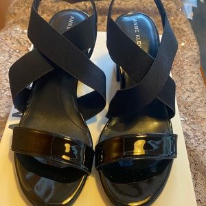 Anne Klein black patent and stretch strap sandals. size 6.